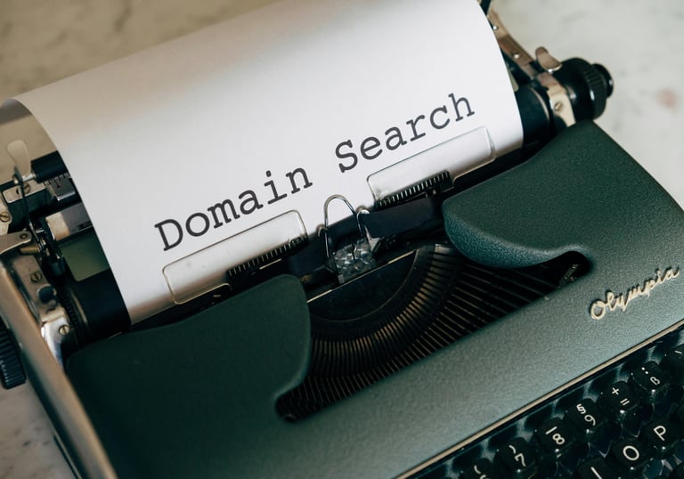 Vintage Olympia typewriter with white paper displaying a Domain Search heading.