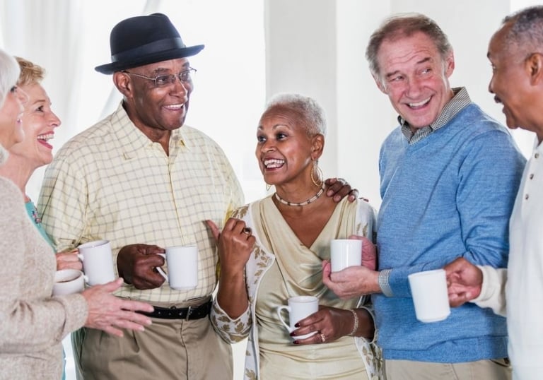 group of seniors having coffee together