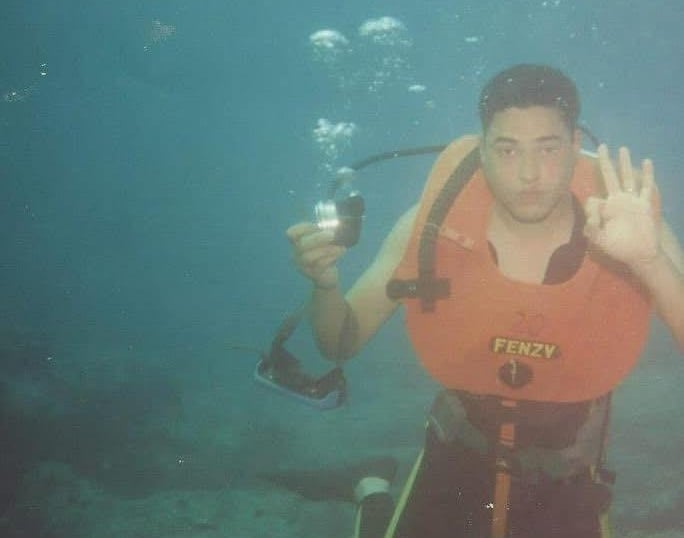 Captain Essam in Navy With old diving equipment 