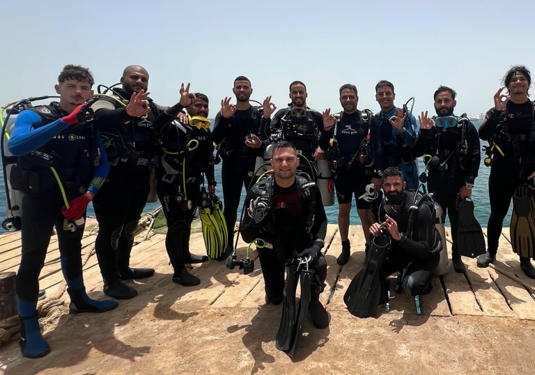 a group of scuba divers in full body suits