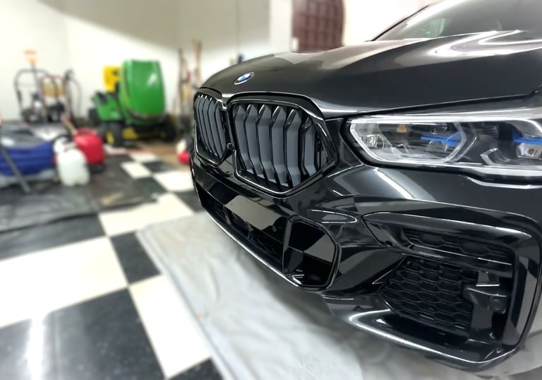 mobile detailing of luxury black bmw suv