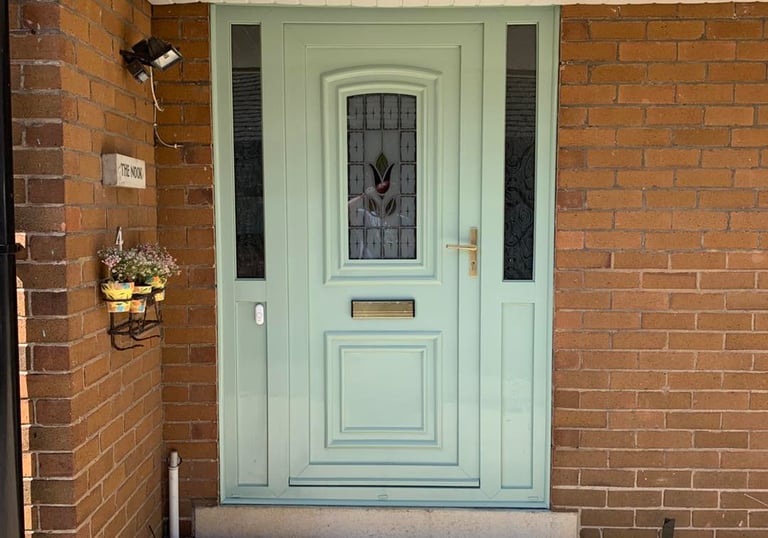 Blackpool PVC door painted in pastel green