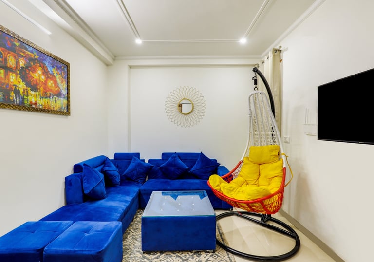 "Living room of 2 BHK apartment with sofa and décor" "Dining area in 2 BHK apartment"