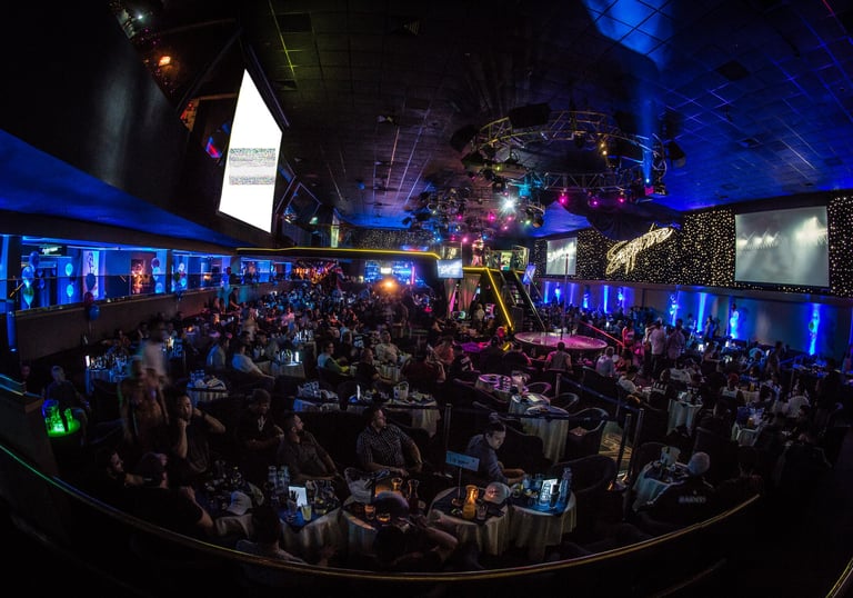 Crowd inside a Las Vegas strip club watching live stage performances
