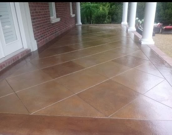 a porch with a brick wall and a brick wall