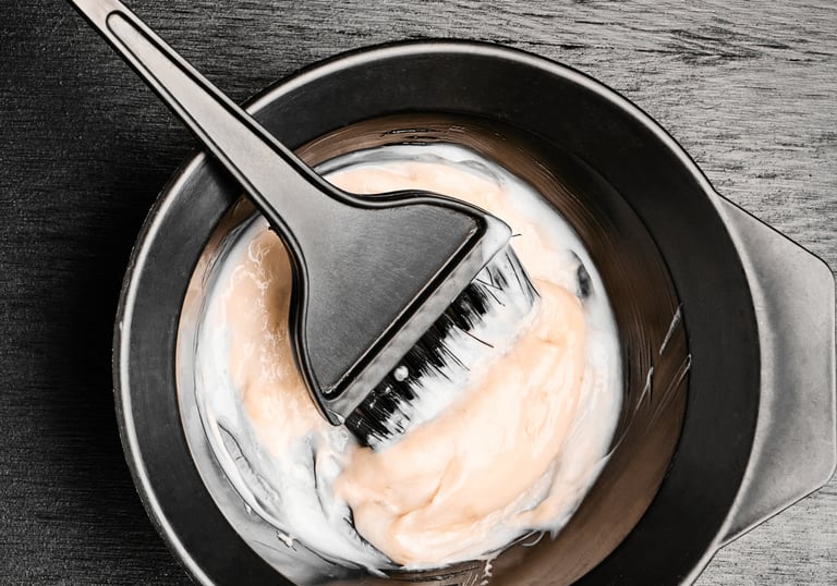 Hair color mixed in a  bowl and brush  Hair color services image  in Brookfield IL