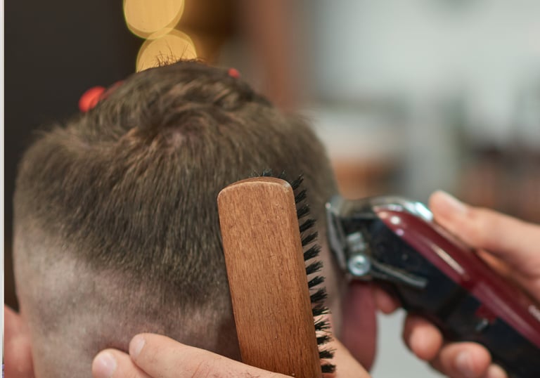 Clippers fading side of mans hair Men's haircut in Brookfield IL