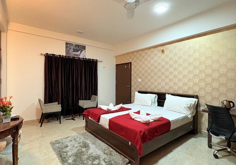 a bedroom with a bed and a desk