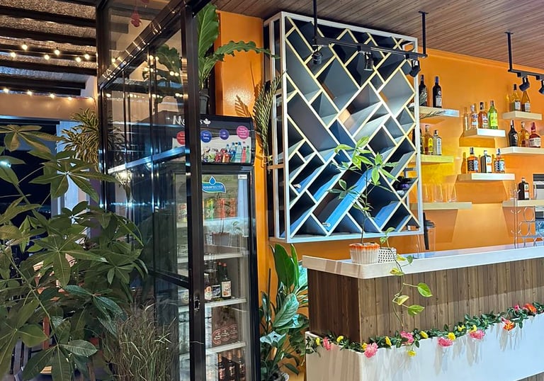 a bar with a wine rack and a stock of alcoholic beverages