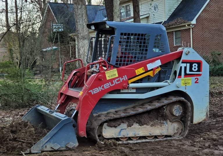 Skid Steer grading and land clearing by Storm Valley Landscape