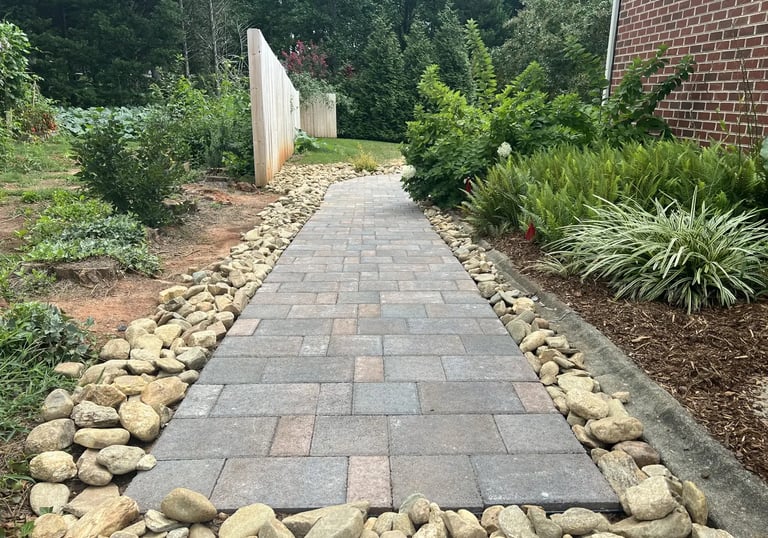 Custom paver walkway by Storm Valley Landscape, enhancing residential curb appeal with professional 