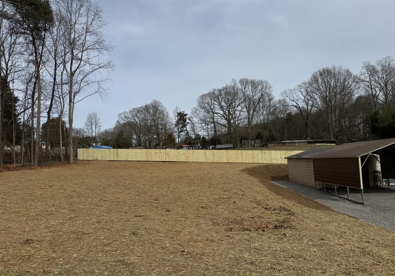 Expert site prep and soil grading to prevent water runoff and erosion for a North Carolina home.
