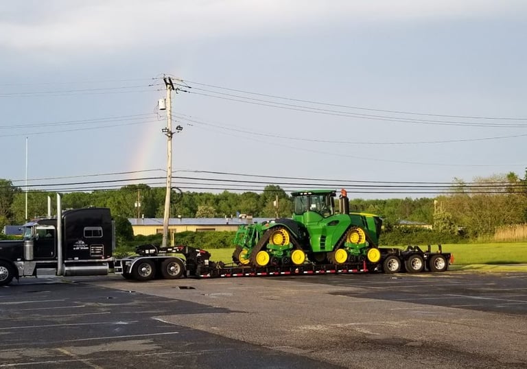 a tractor trailer with a rainbow - colored rainbow - colored rainbow - colored rainbow -