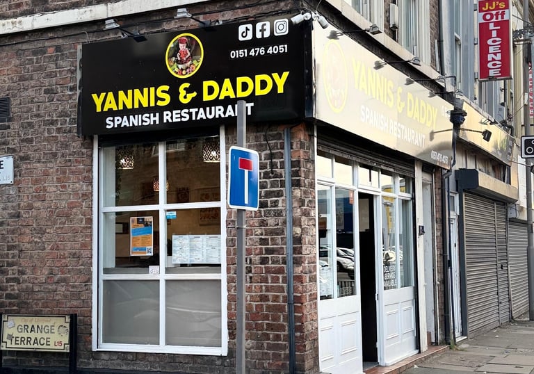 a restaurant with a sign that says Yannis and daddy