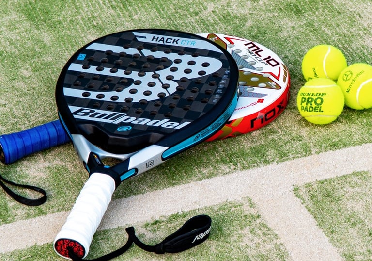 padel rackets and padel balls on a padel court