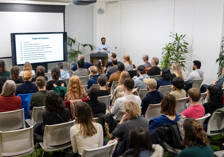 A design professional delivering a talk at a design conference