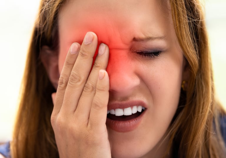 a woman with a red eye, indicating a problem