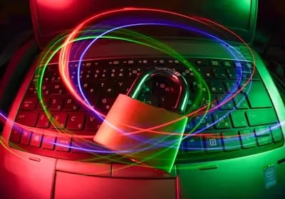 Neon laptop with colorful trails showing strong crypto exchange security