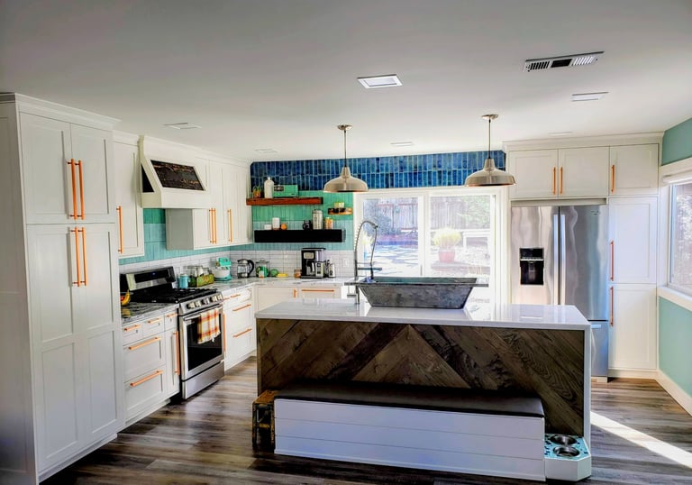 modern smart kitchen with waterfall island counter. Custom French bath sink, storage bench, and built in dog bowl area.
