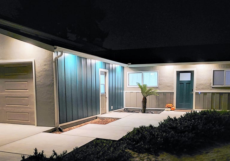 exterior home renovation. custom concrete walk way, new side paneling, windows and custom paint. Colorado Springs remodel.