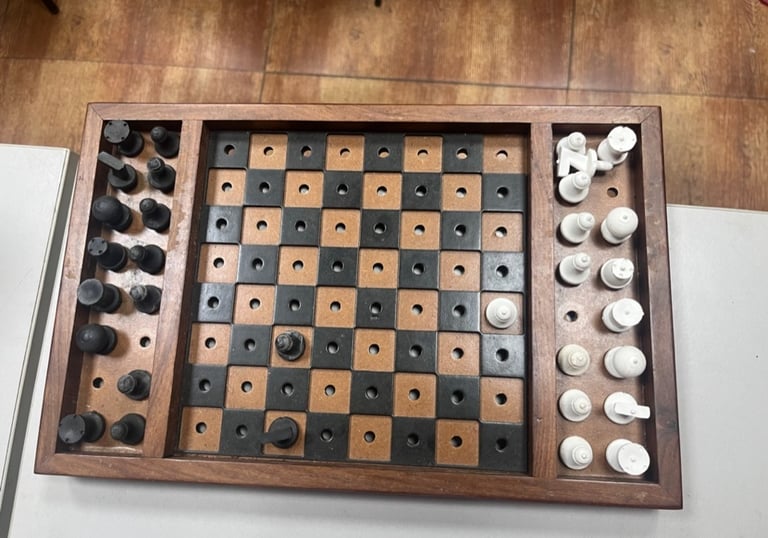 A chess board with tactile pieces 
