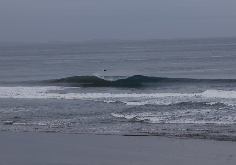 A lonely perfect wave breaking at an Ecuadorian Beachbreak