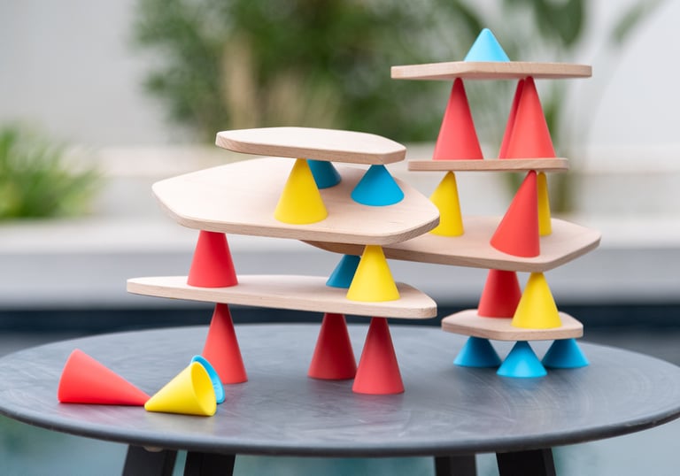 An educational game for creating structures from colored silicone cones and wooden tables