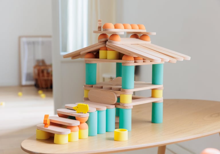 A house constructed using colorful silicone and wooden parts of a children's educational game