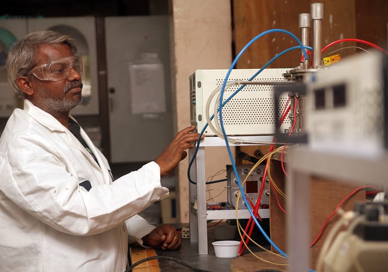 a man in a lab coat and glasses