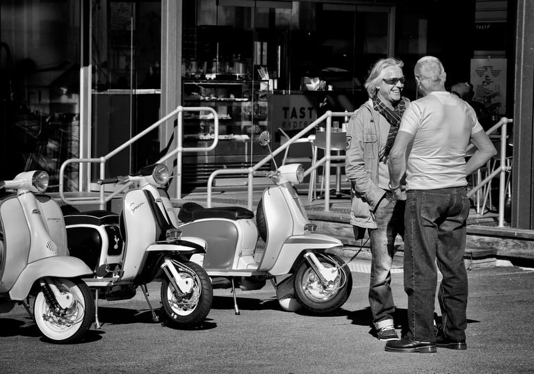 Motor scooter club outing - two men chatting