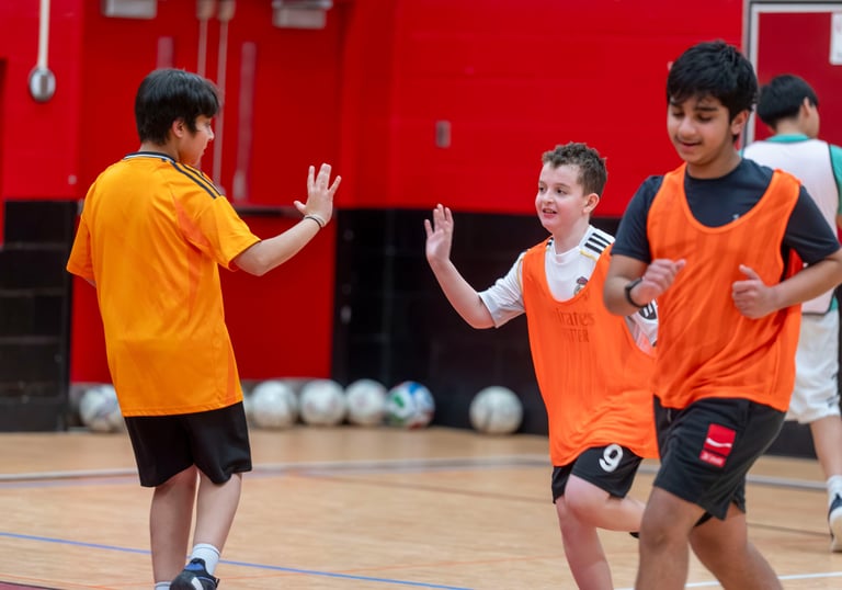 MVB FC kids playing indoor soccer, giving each other high fives sports match. Mississauga
