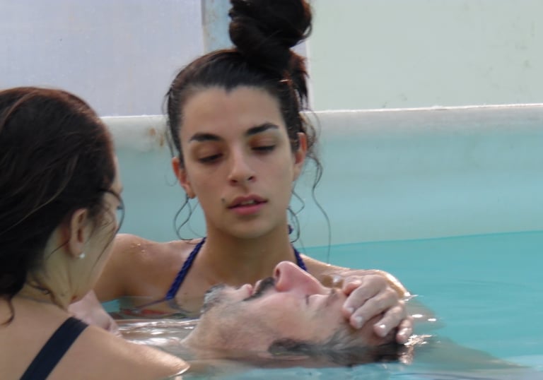 a man and woman in a swimming pool, rebirth and Repair, watsu