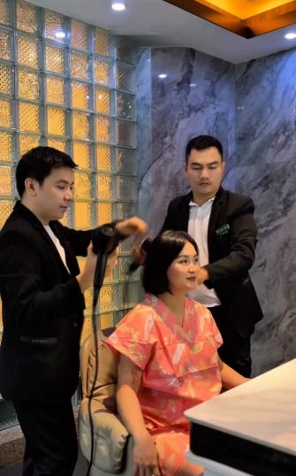 a man and woman in a salon