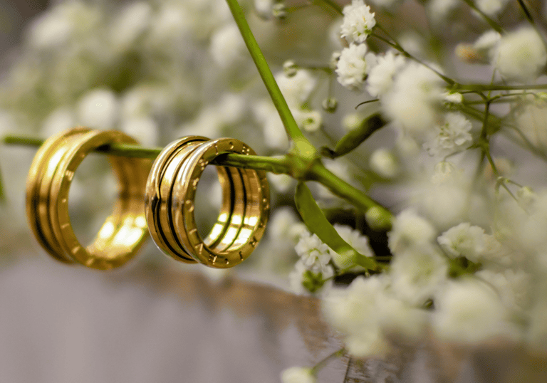 two wedding rings with wedding rings on them
