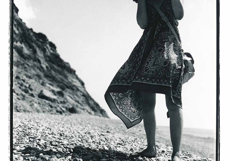 Woman on the beach, an analogue black and white picture. Portrait photography.  Author: Slawek Dejneka