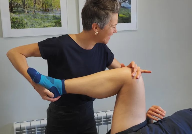 Therapist giving treatment for hip pain