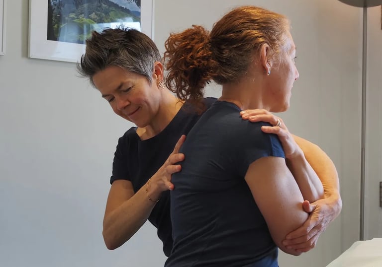 Therapist treating patient's upper back