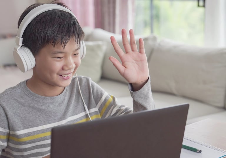 a boy with headphones and headphones on a couch