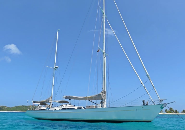 a sailboat in the ocean with a sailboat in the water