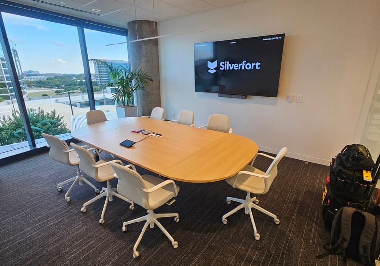 Corporate office video meeting room with Neat brand video conferencing bar - Metroplex Smart Homes