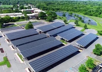 Aerial view of a commercial solar panel carport installation providing renewable energy and shade.