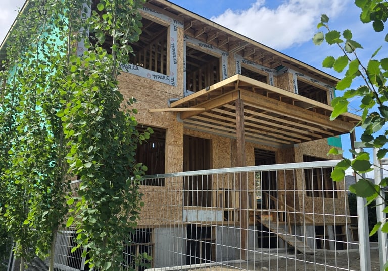 Custom duplex construction with wood framing on a Calgary residential lot.