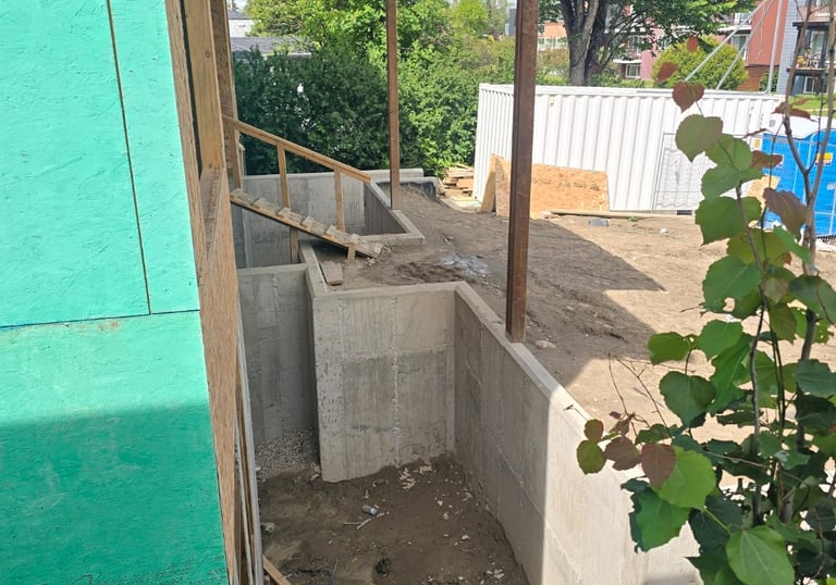 Site preparation and structural work including excavation, foundation, and framing.