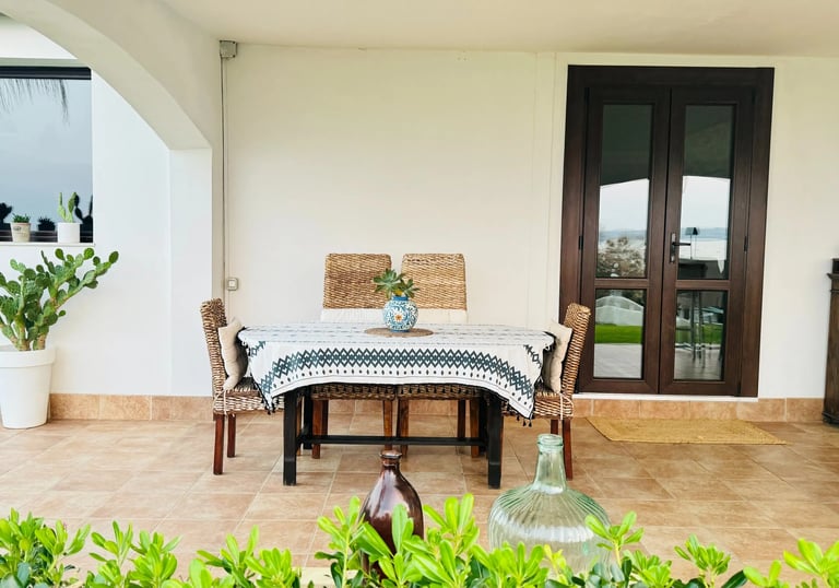 Covered terrace with dining table at luxury seaside villa in Sicily, Villa Incanto on the Sea