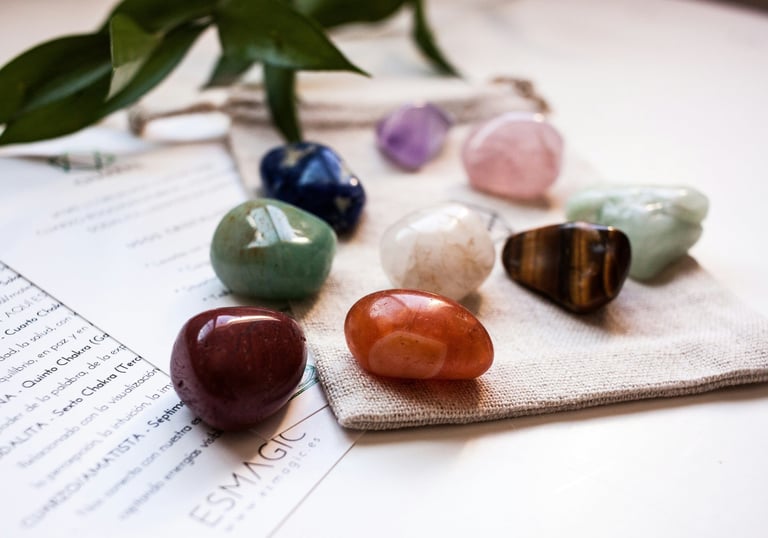 a group of coloured stones sitting on top of a piece of paper
