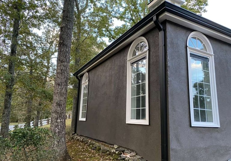 Home with 6K aluminum gutters showing proper pitch and clean installation