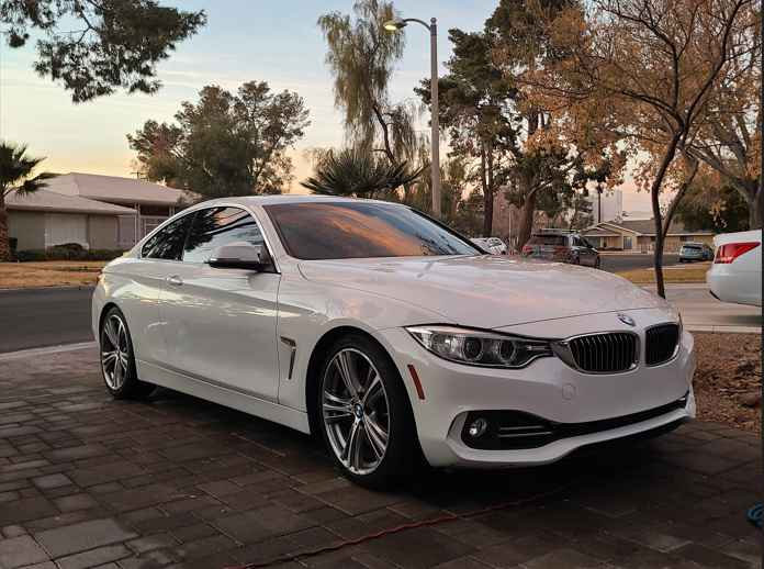 Clean white BMW sedan shining after Signature Detail package from Las Vegas mobile detailing.