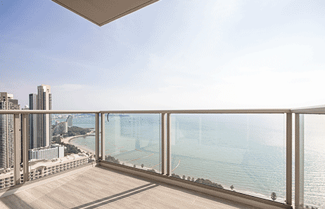a balcony with a balcony with a view of the ocean