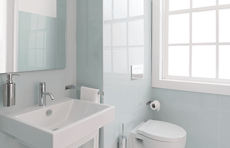 a bathroom with a toilet and a sink