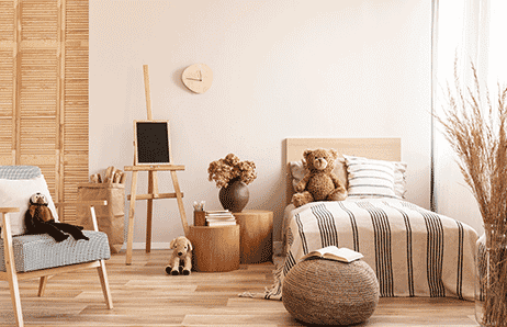 a bedroom with a bed, chair, and a chair